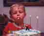 Joe blowing out candles